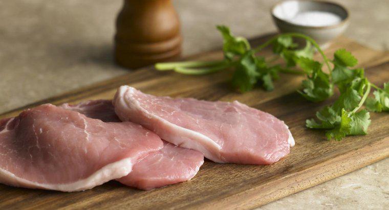 ¿Cuánto tiempo se cocinan chuletas de cerdo deshuesadas en un horno?
